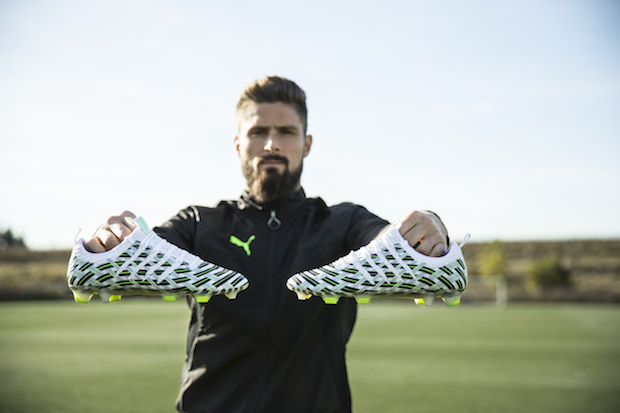 Olivier Giroud holding Puma evoPOWER Vigor in Camo