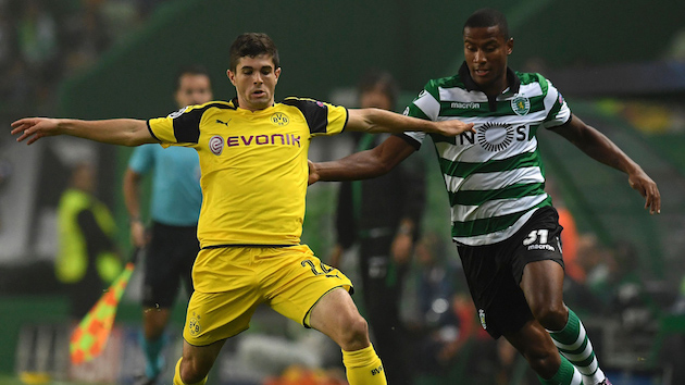 Dortmund's Christian Pulisic fights for ball in Champions League